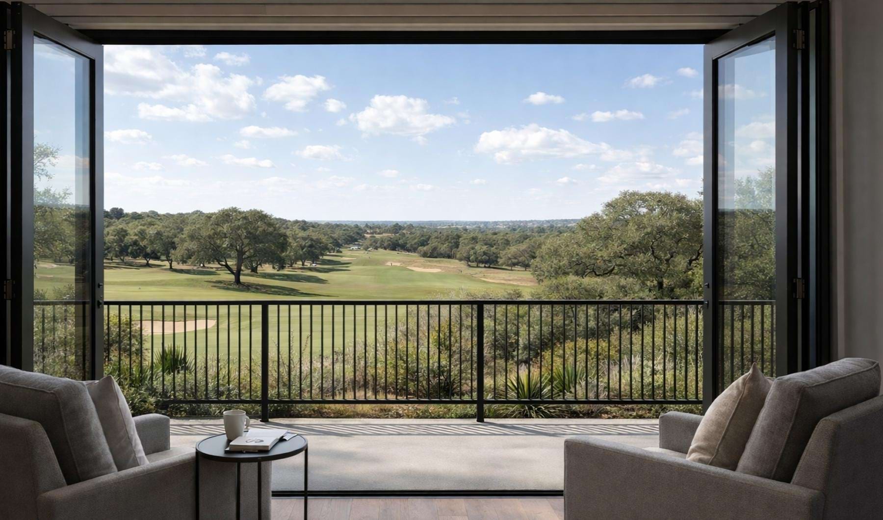 a room with chairs looking out at a golf course