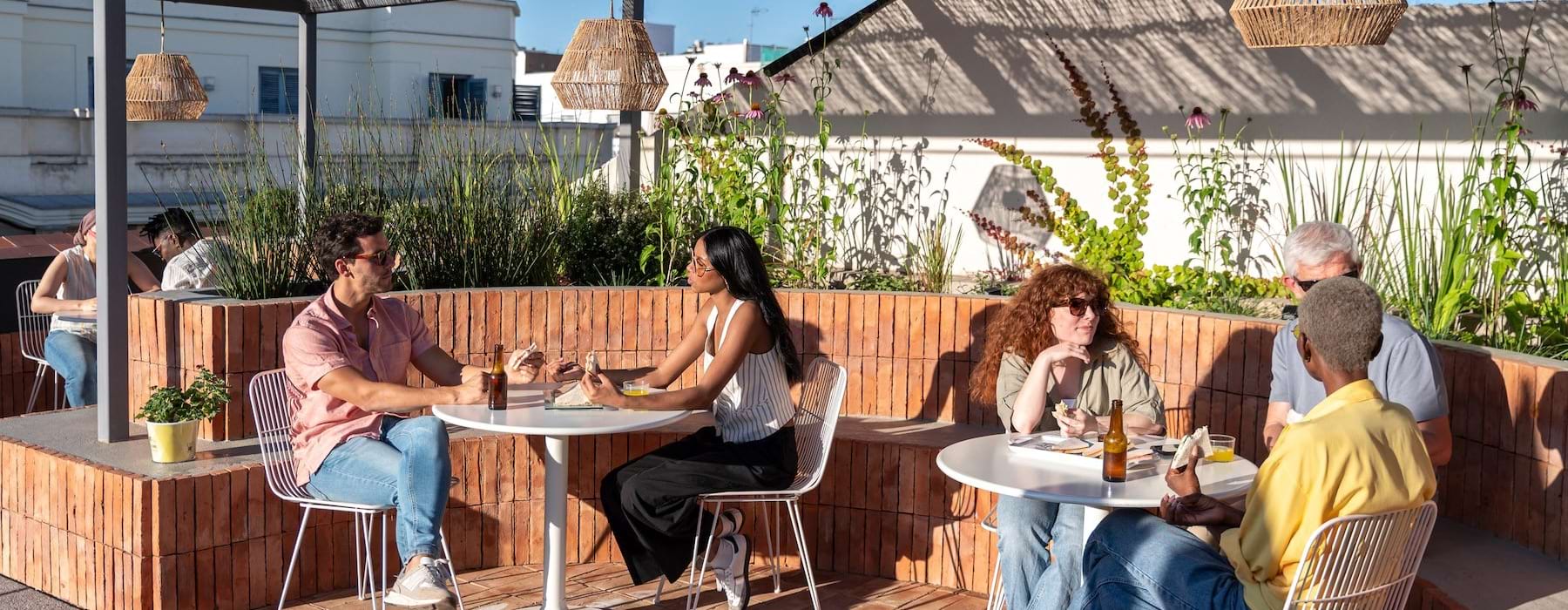 people sitting at tables with drinks