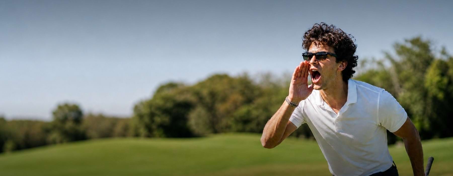 a man yelling at a golf course