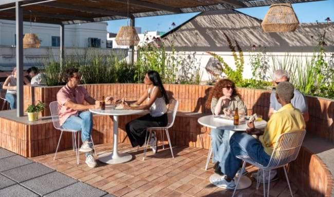 people sitting at tables with drinks